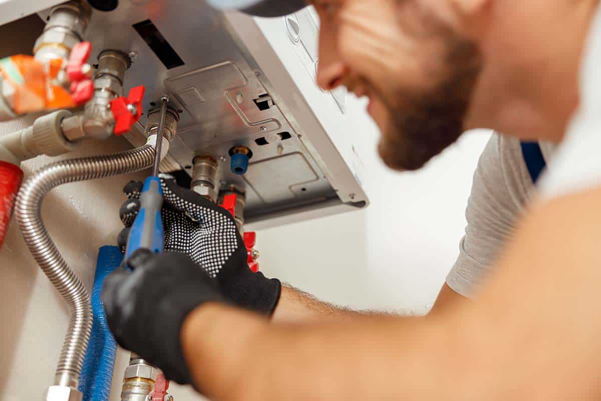 boiler engineer installing boiler central heating system in London