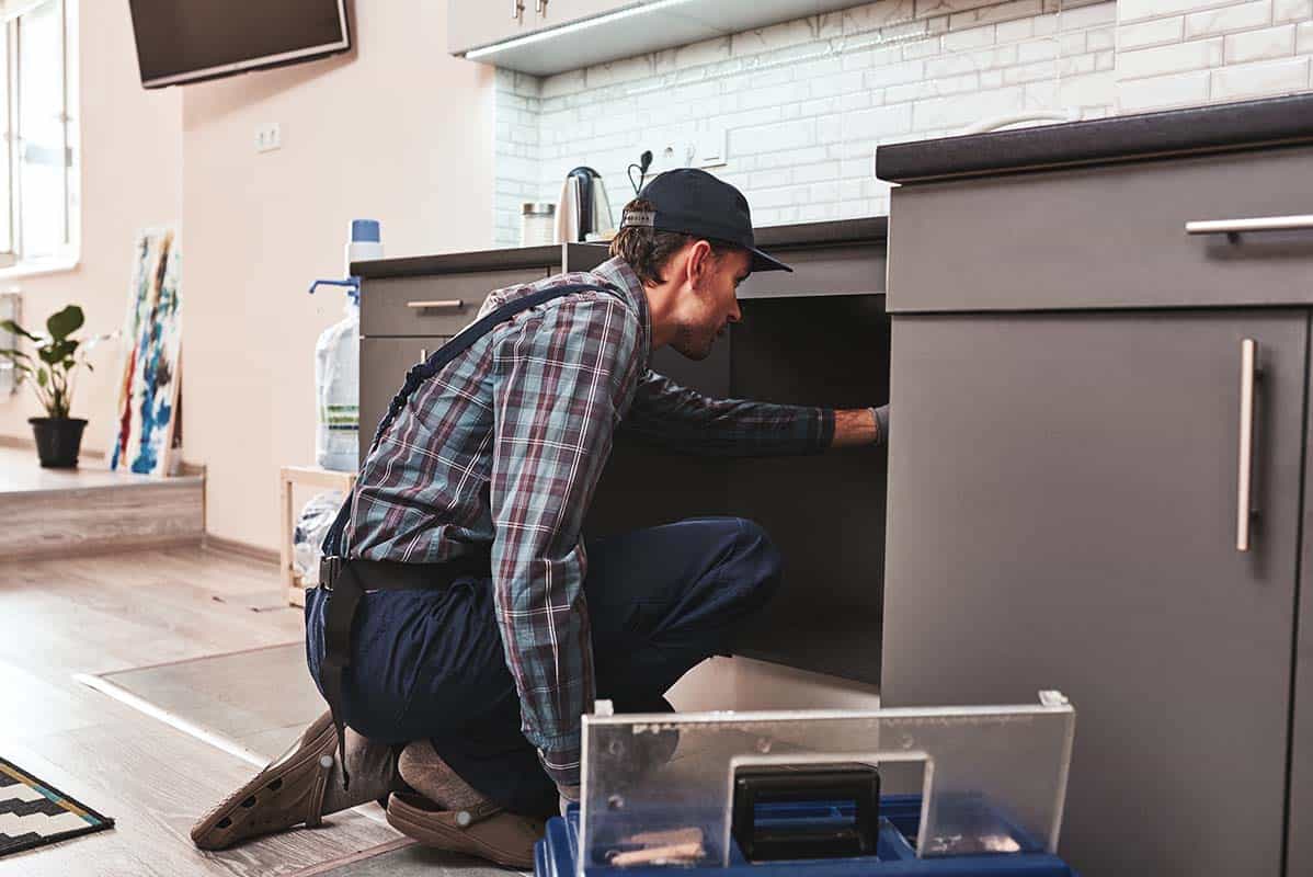 plumber checking for blocked drains