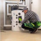 boiler technician checking a gas boiler system
