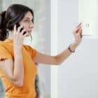 woman calling a boiler repair service for her worcester boiler problem